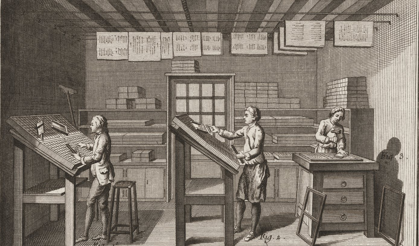 Engraving of an eighteenth-century print shop: three compositors at slanted type cases set lines of type by hand, printed sheets hang drying overhead.